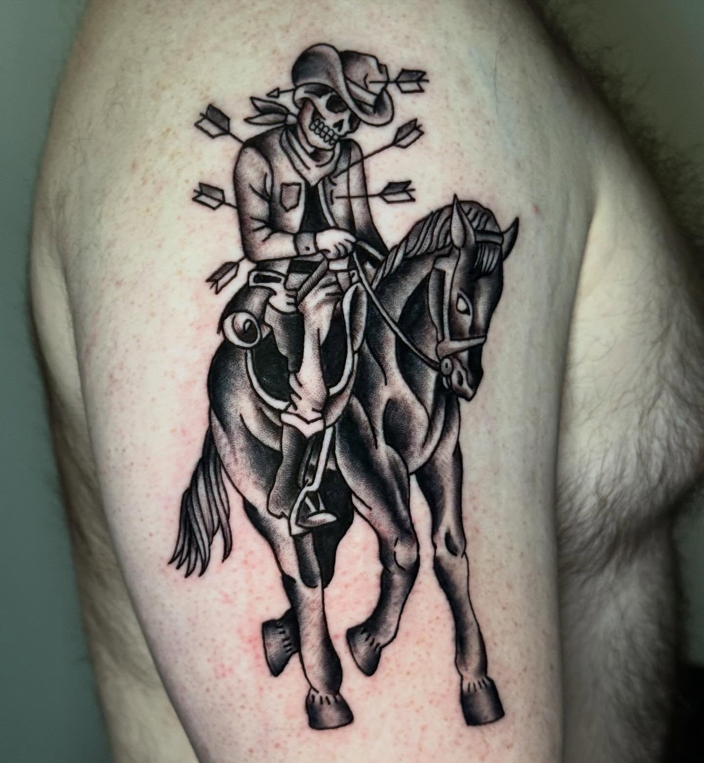 Skull on horseback black and grey tattoo on the thigh by CAT