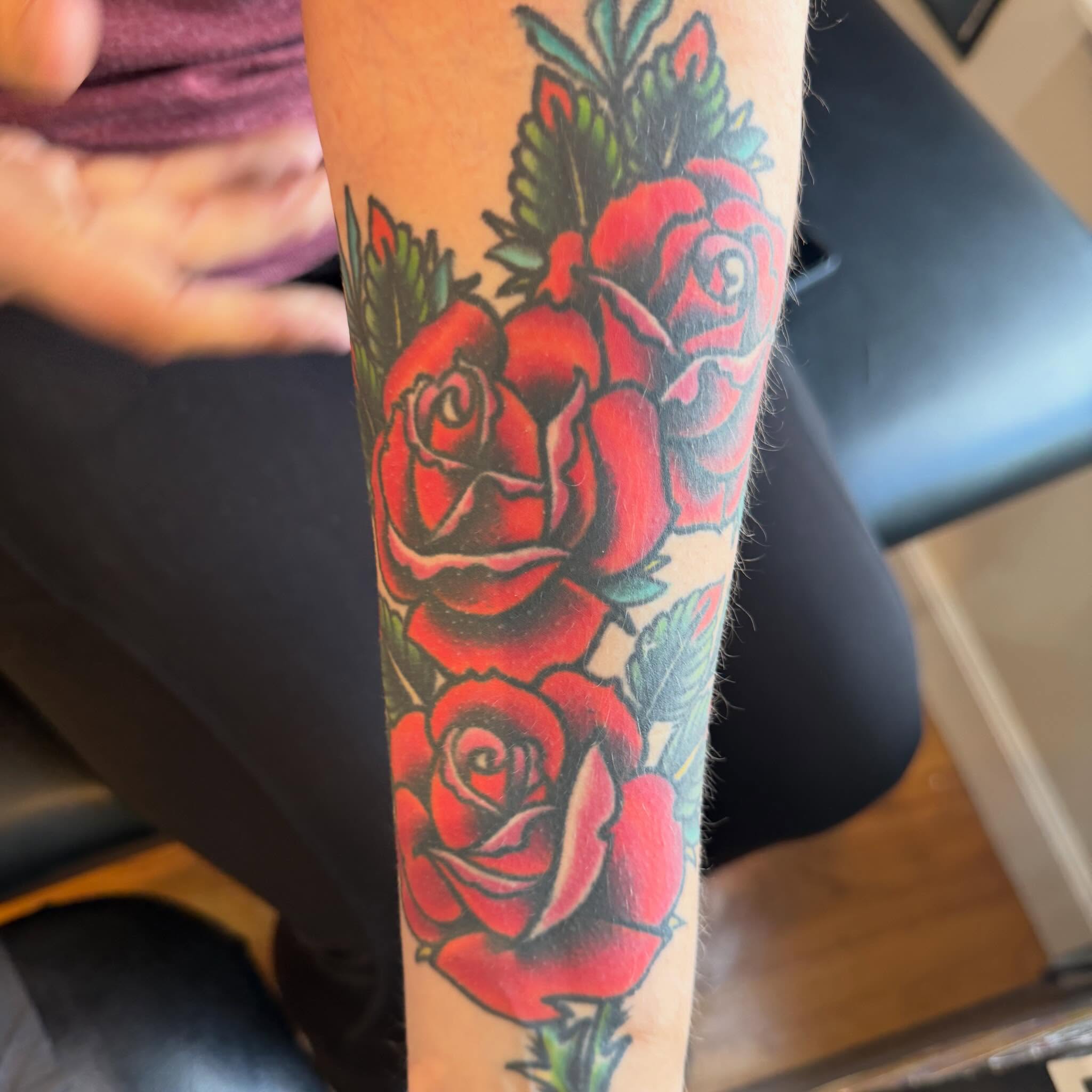 Roses American traditional tattoo on the forearm by Mike Kepper