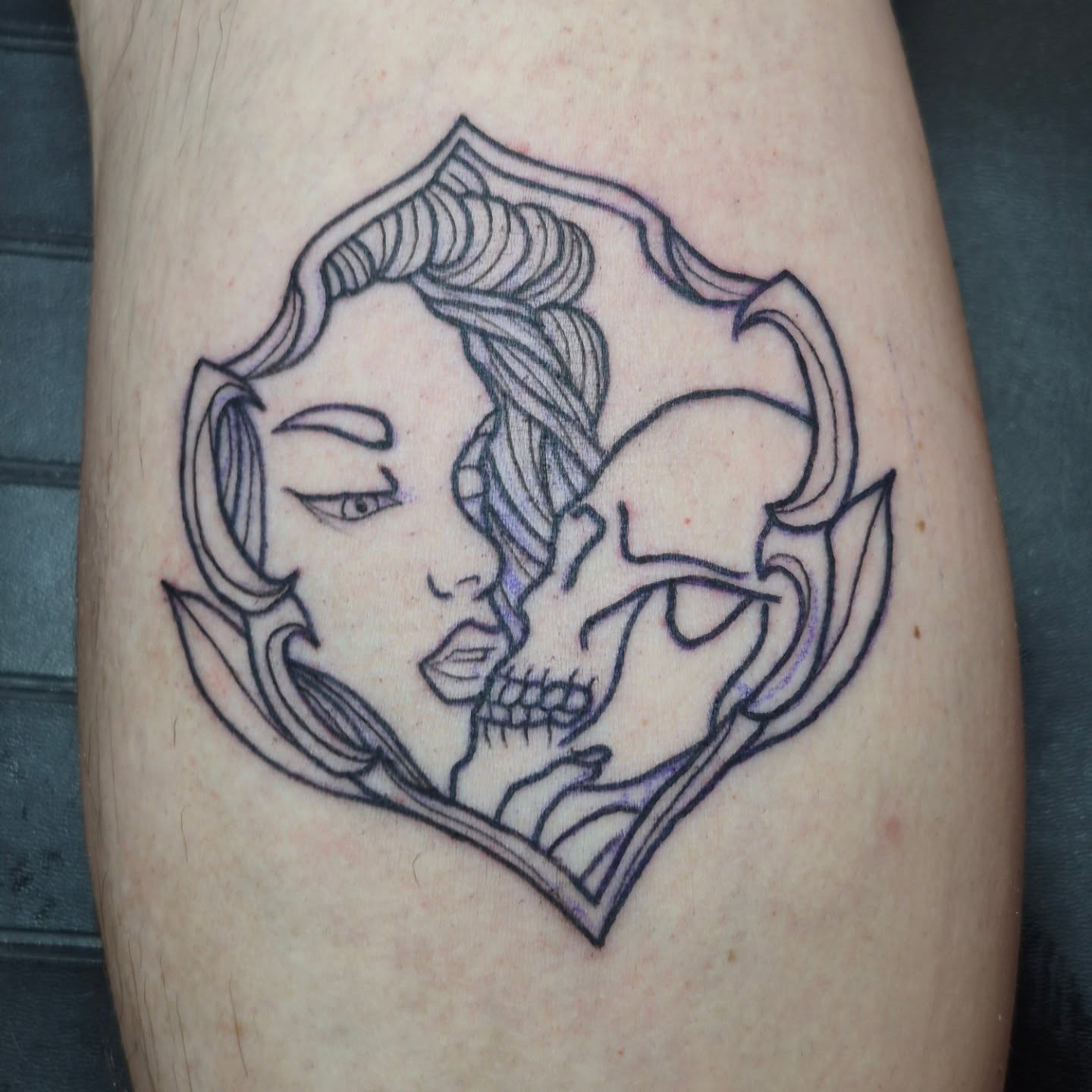 Woman and skull geometric tattoo on the thigh by Bobby H