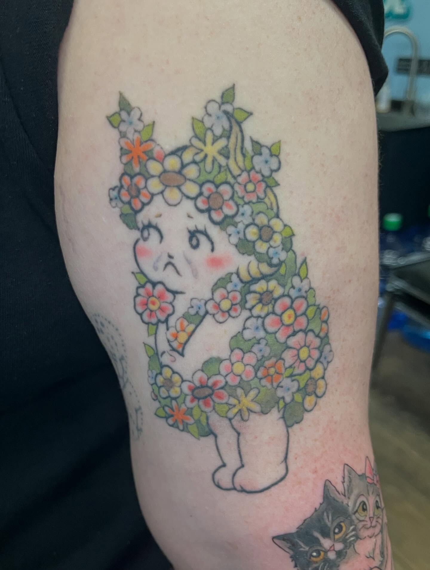 Flowered cat new school tattoo on the forearm by Brianna Jo Ballinghoff