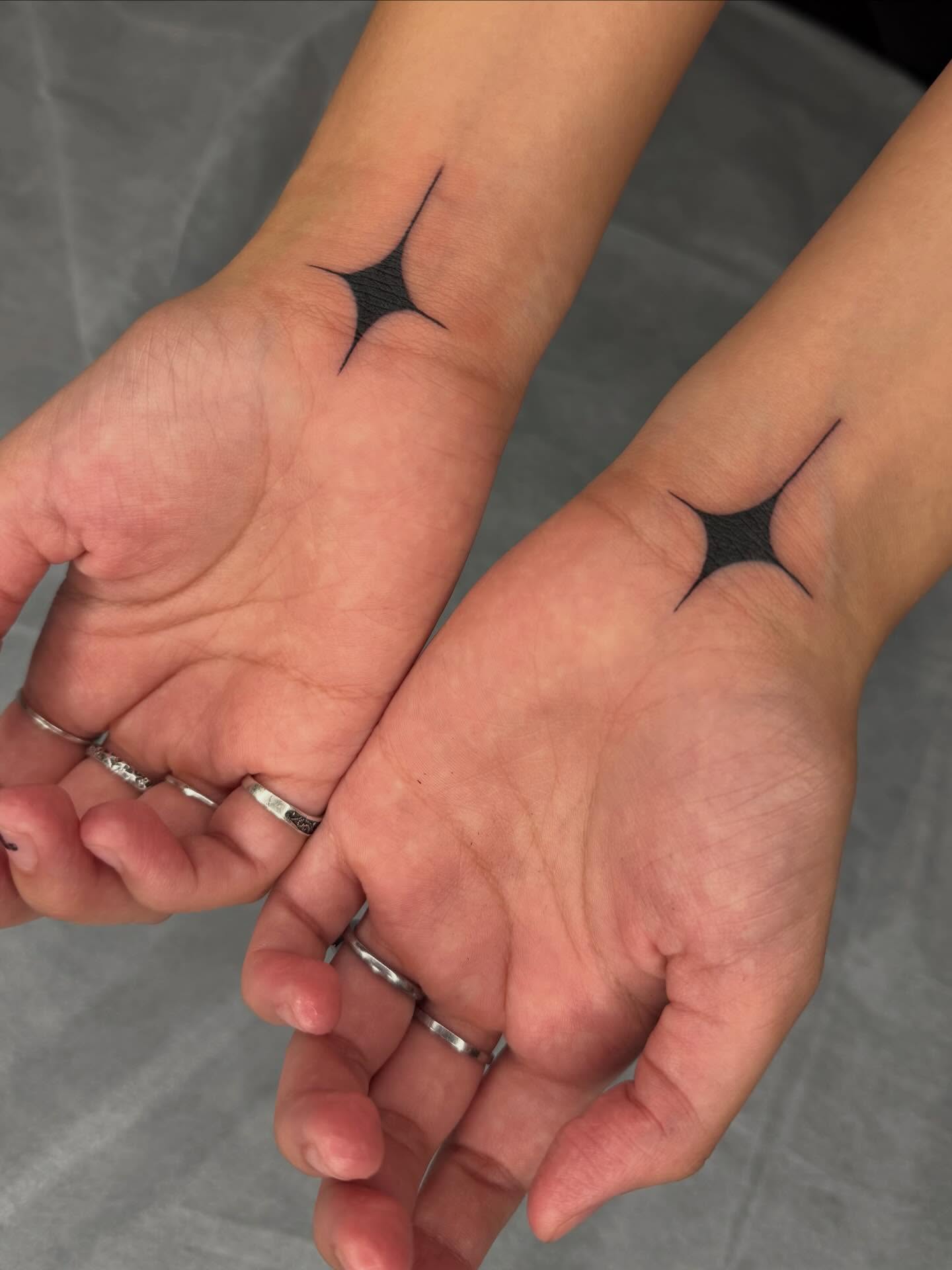 Spiky star geometric tattoo on the hand by Maggie Angulo