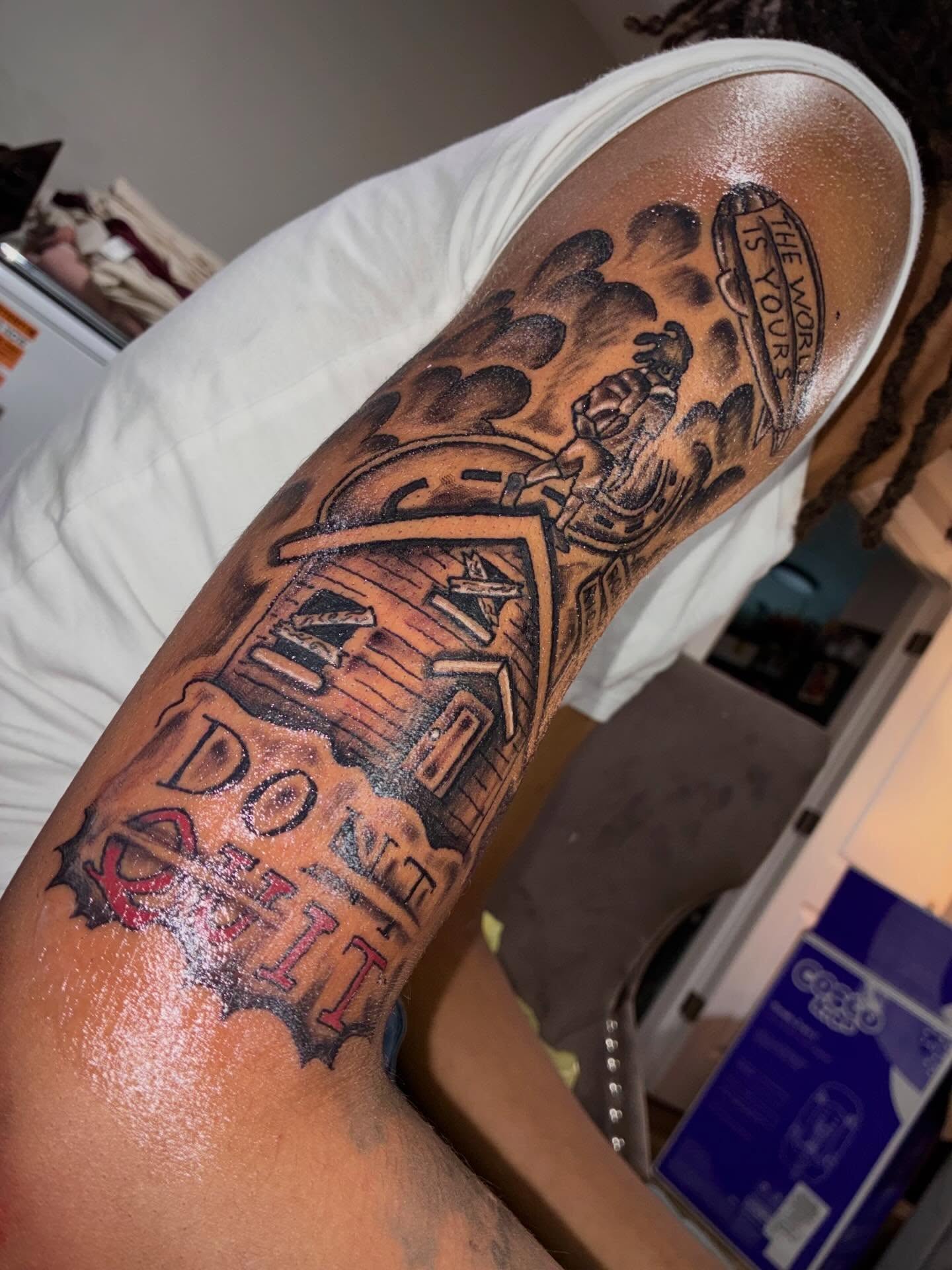 Street sign black and grey tattoo on the forearm by Sonya son tattoos and piercings