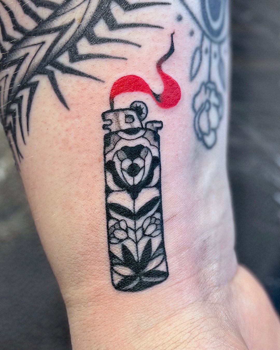 Vase with floral design black and grey tattoo on the forearm by Kal