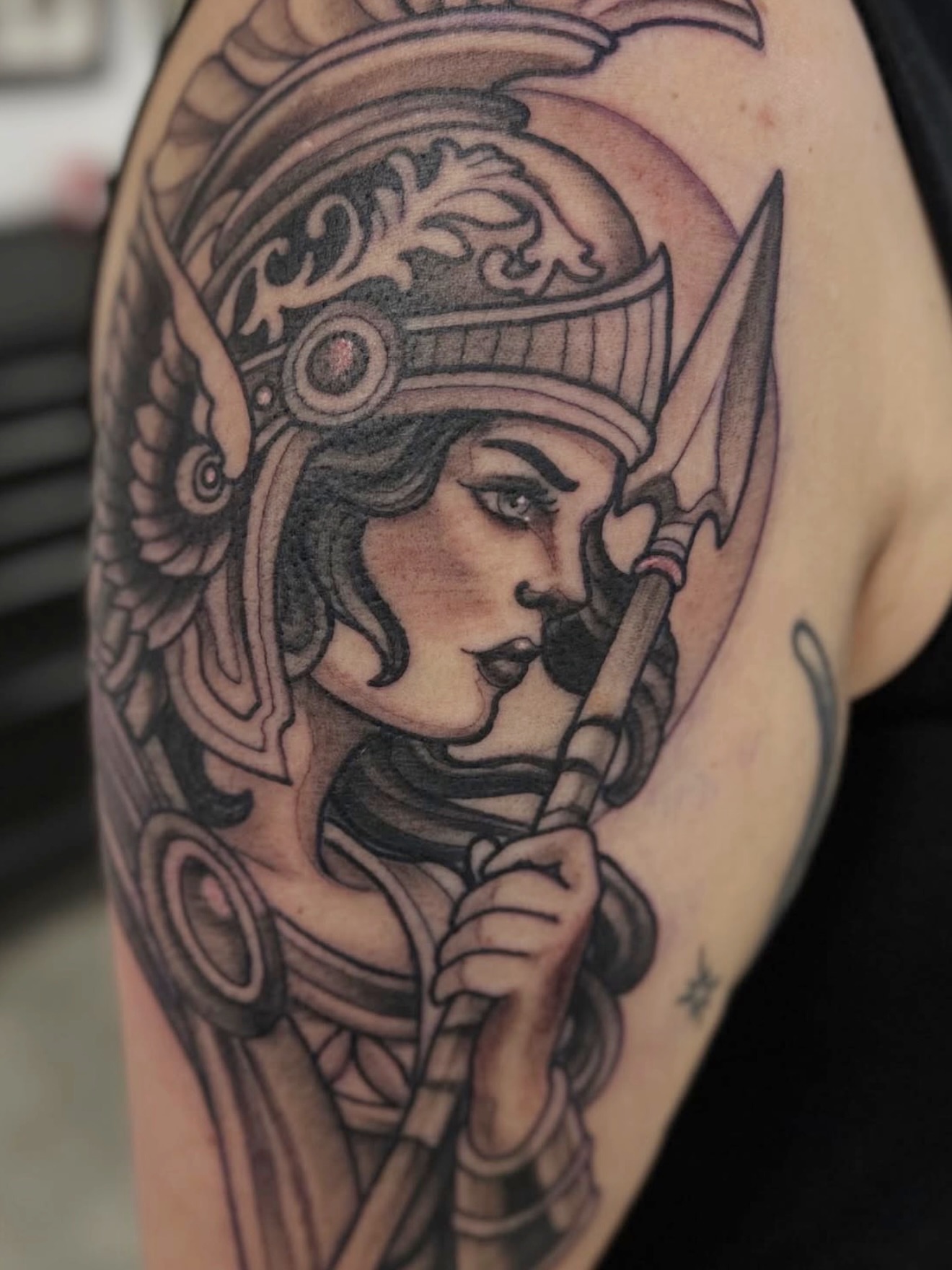 Female warrior American traditional tattoo on the shoulder by Christopher Layman