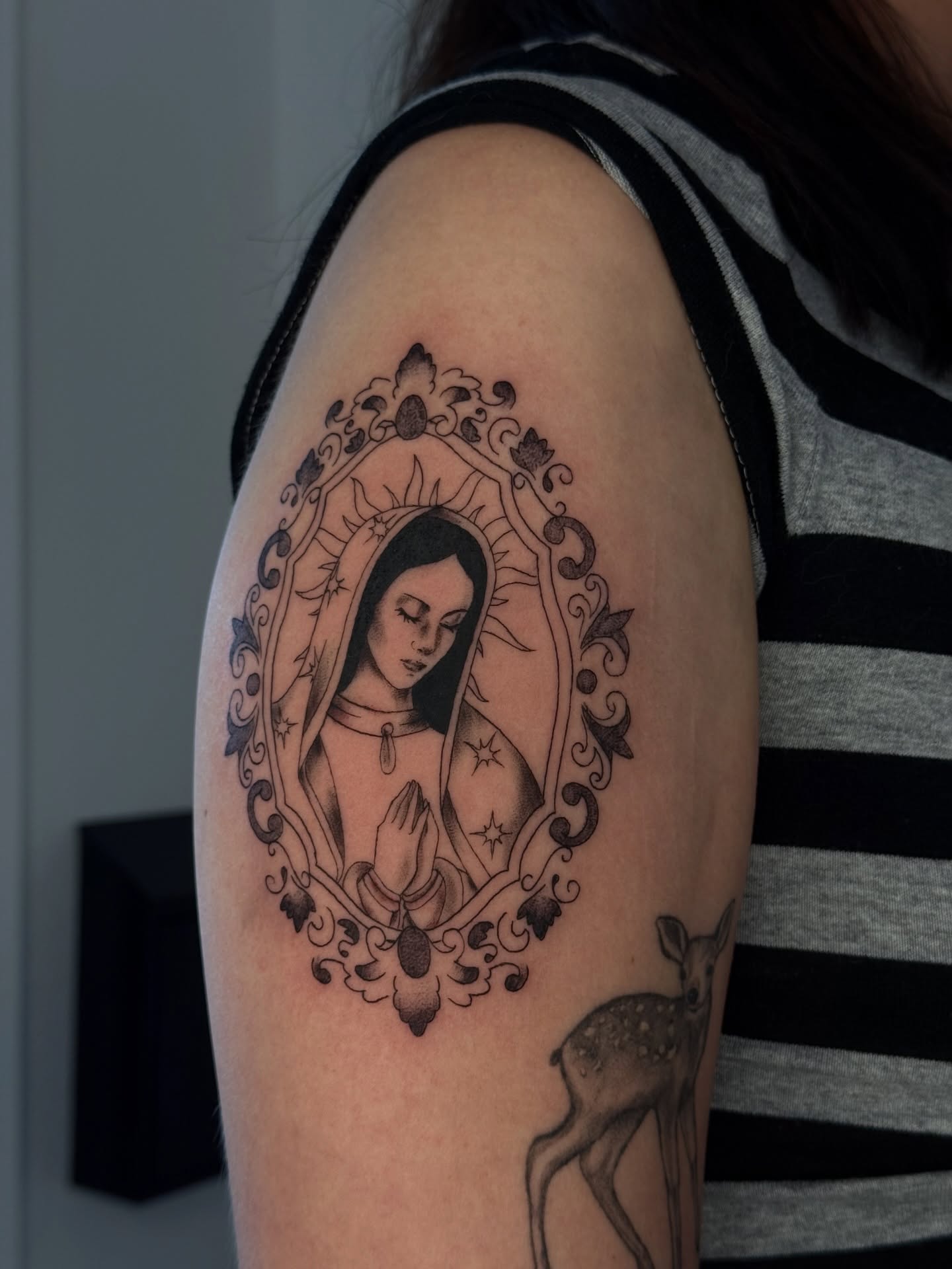Religious figure black and grey tattoo on the shoulder by šianca٠࣪ā