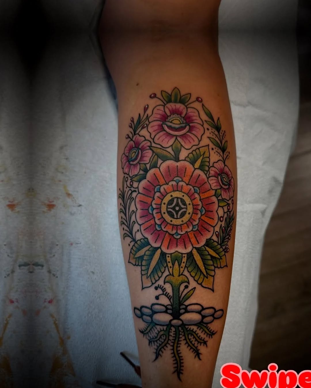 Floral bouquet with roots neo-traditional tattoo on the forearm by @jose.phinelynch