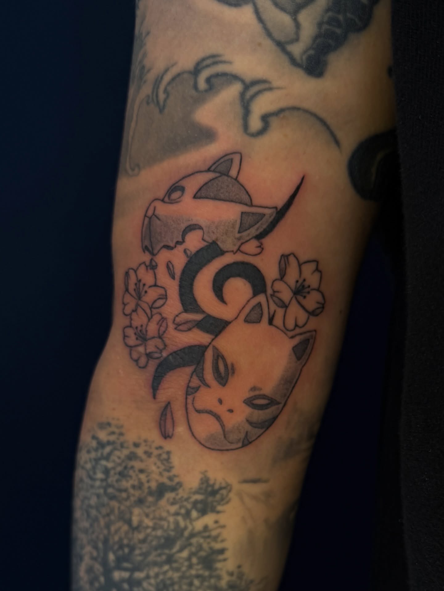 Cat and cherry blossoms black and grey tattoo on the forearm by Kevin, Las Vegas, Nevada