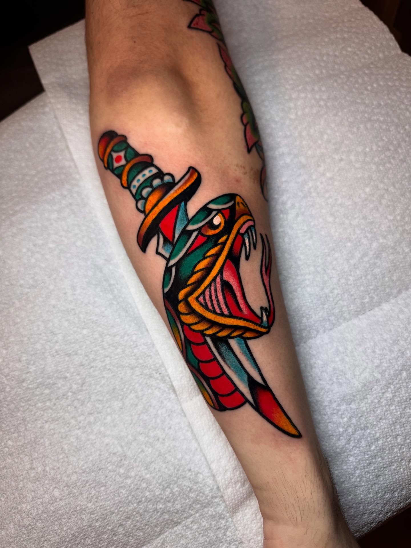 Snake and dagger American traditional tattoo on the forearm by Jonathan Clapp, San Antonio, Texas