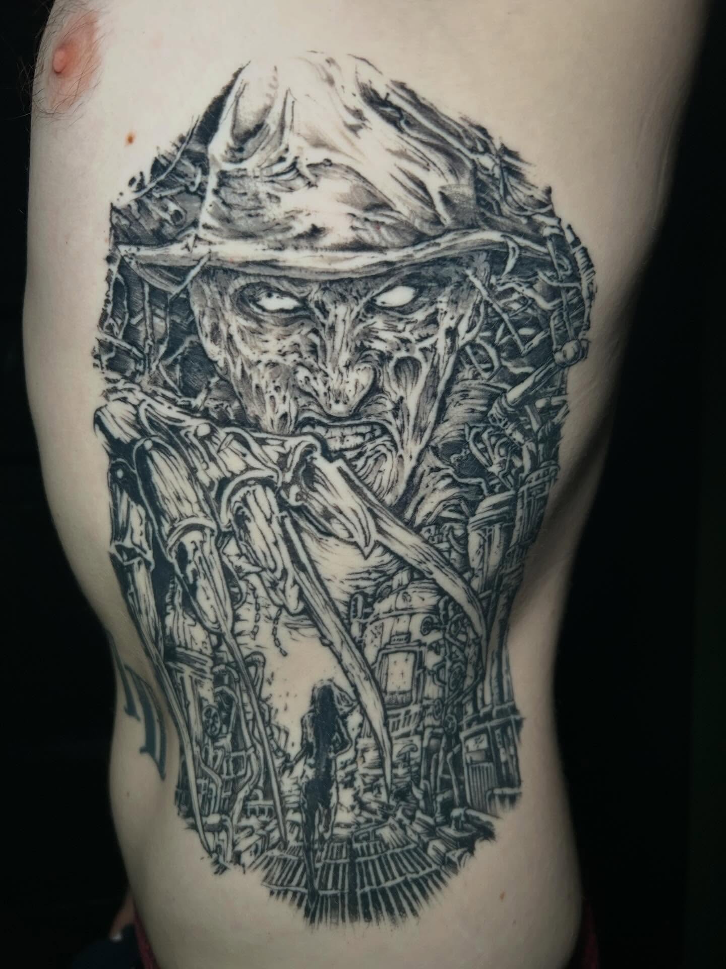 Tattoo by @jon_f_n_story — dark_realism, black_and_grey