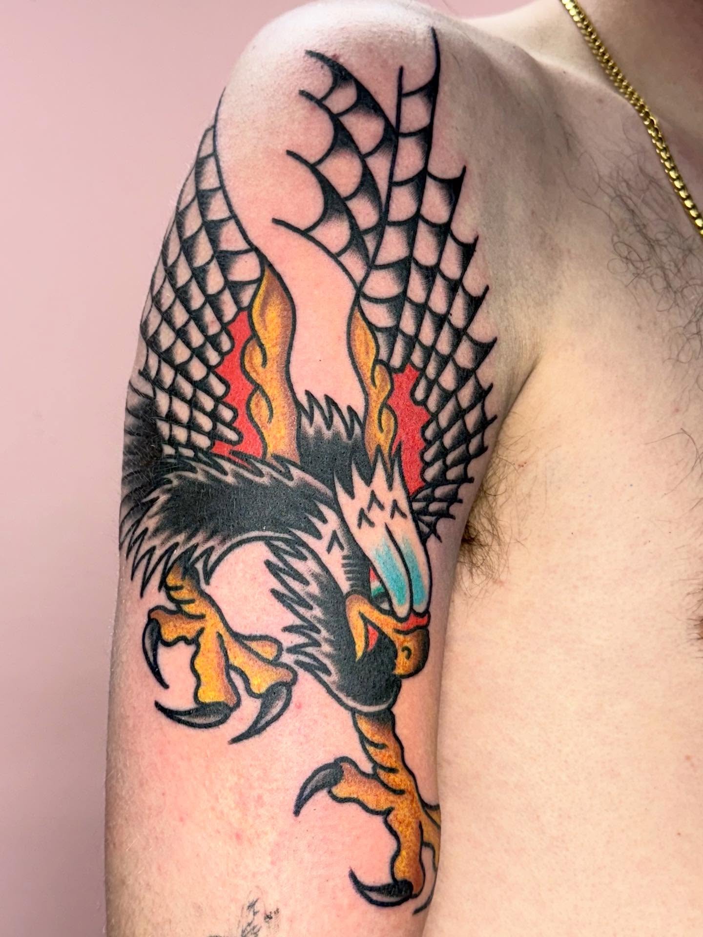 Eagle American traditional tattoo on the shoulder by Jesse Coldiron