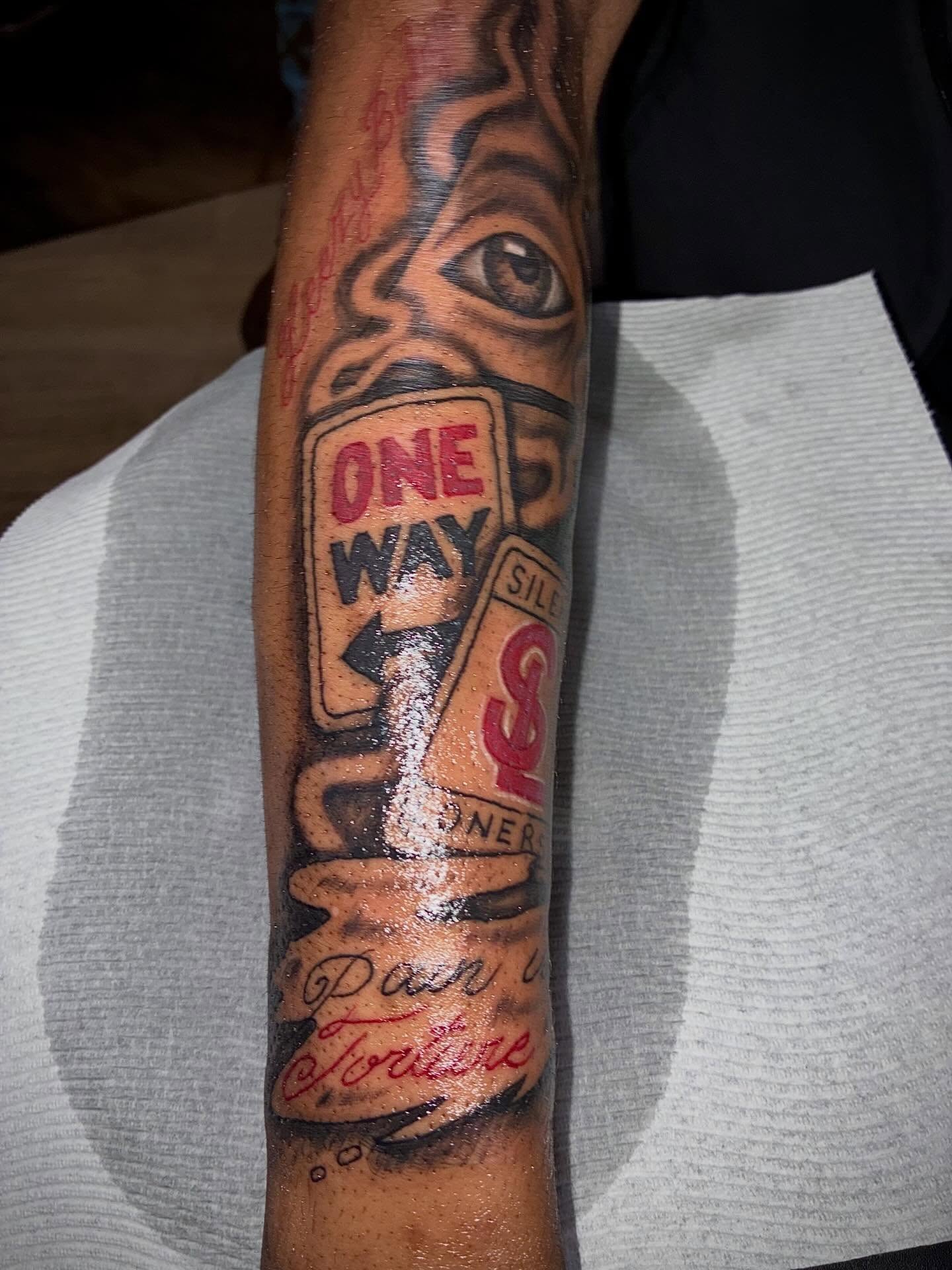 One-way sign American traditional tattoo on the forearm by Sonya son tattoos and piercings