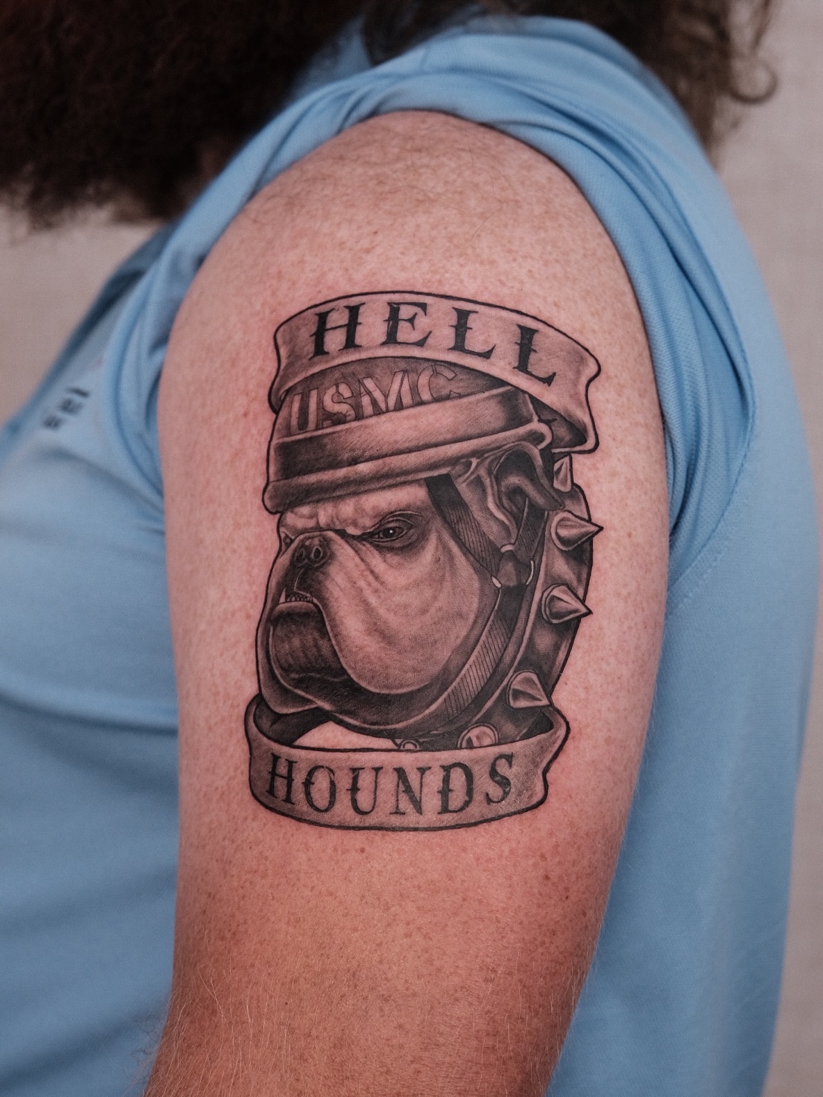 Bulldog wearing USMC helmet realism tattoo on the shoulder by Houston Tattoo Artist GoldenK