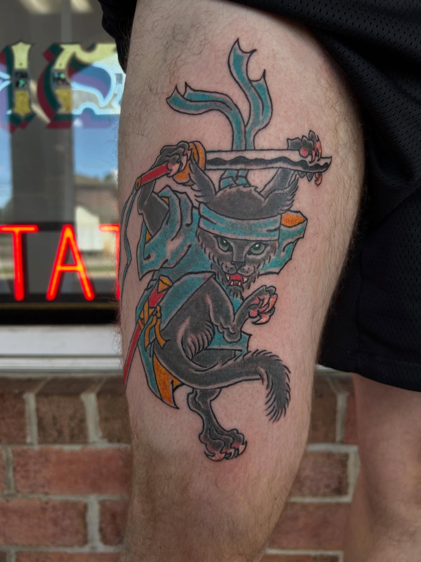 Cat warrior American traditional tattoo on the thigh by Stogie Tony