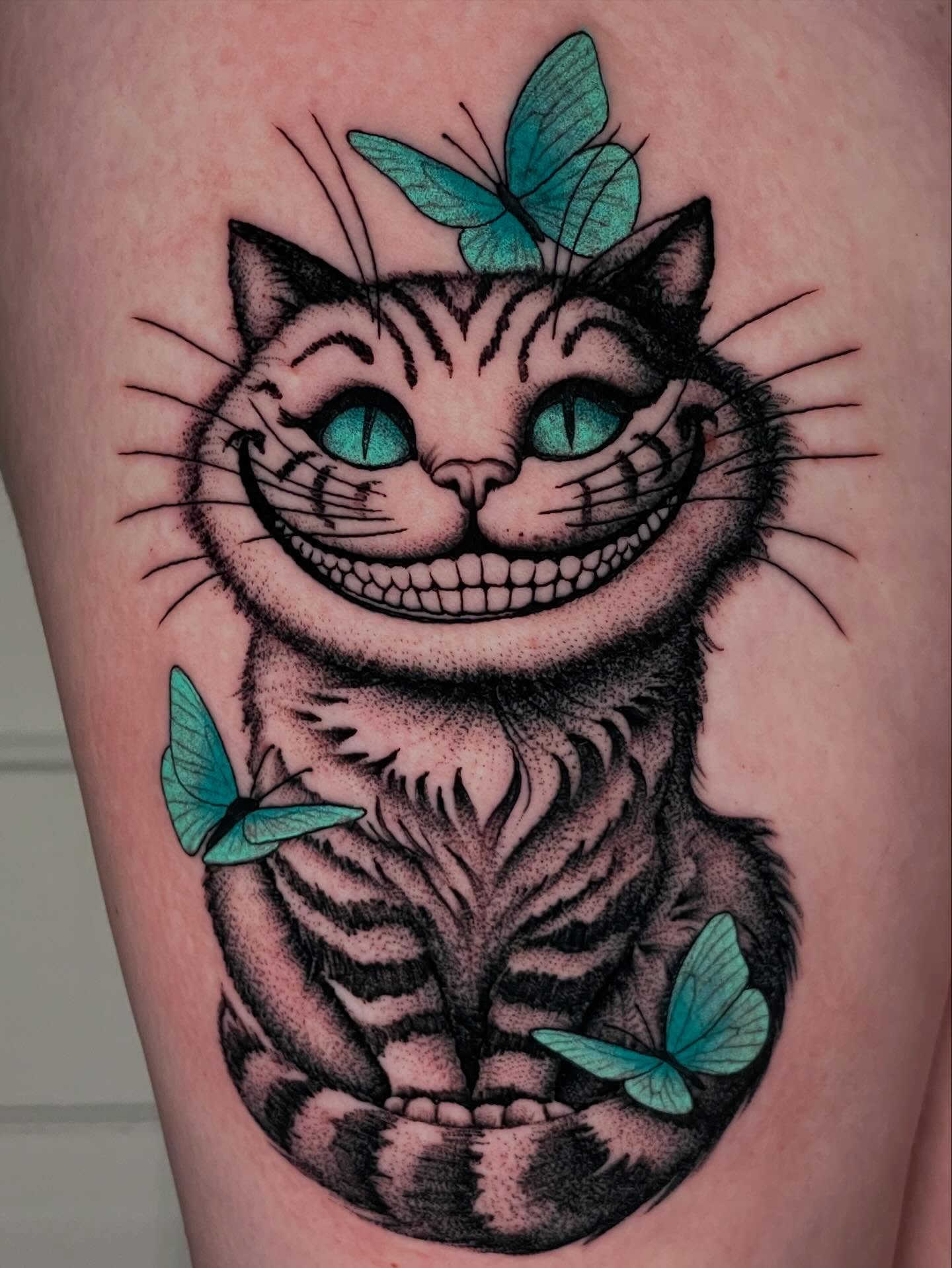 Cheshire cat dotwork tattoo on the thigh by Michael Barnhill Tattooer, Charlotte, North Carolina