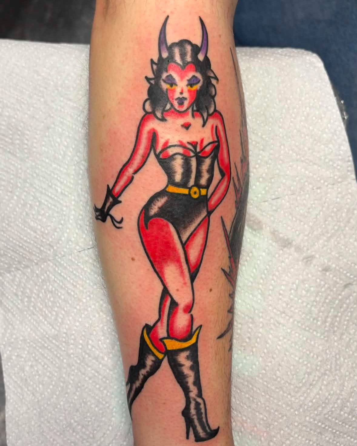 Devil pin-up girl American traditional tattoo on the forearm by Jake Herbert, Knoxville, Tennessee