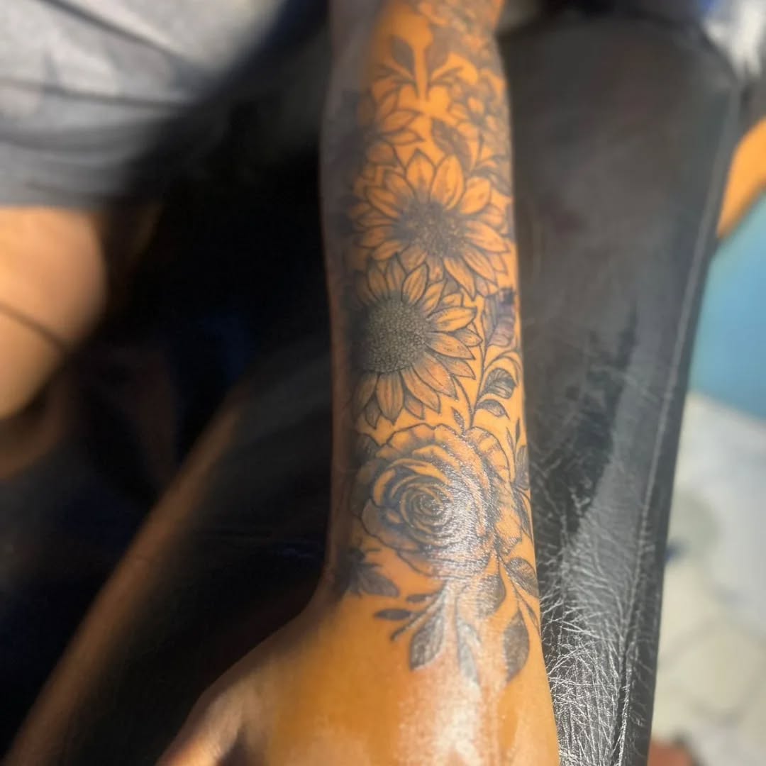 Sunflowers and roses ornamental tattoo on the forearm by Mwangaza Bodyworks, Uthiru, Nairobi Area, Kenya