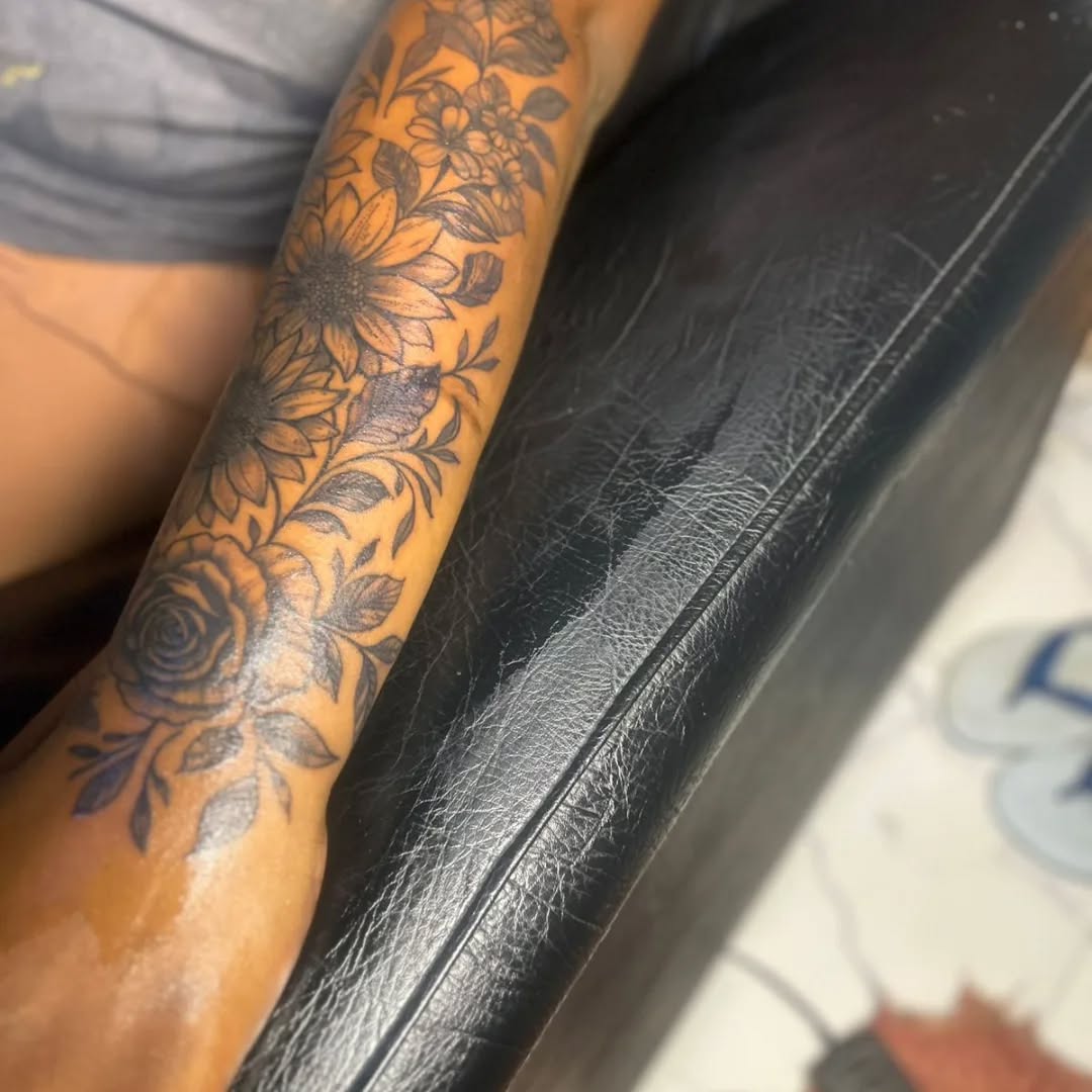 Floral sleeve ornamental tattoo on the forearm by Mwangaza Bodyworks, Uthiru, Nairobi Area, Kenya