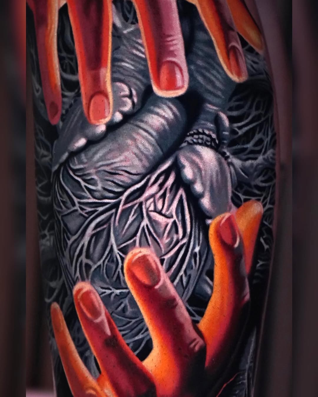 Hands reaching into a textured core surrealism tattoo on the forearm by Sadier Alfonso