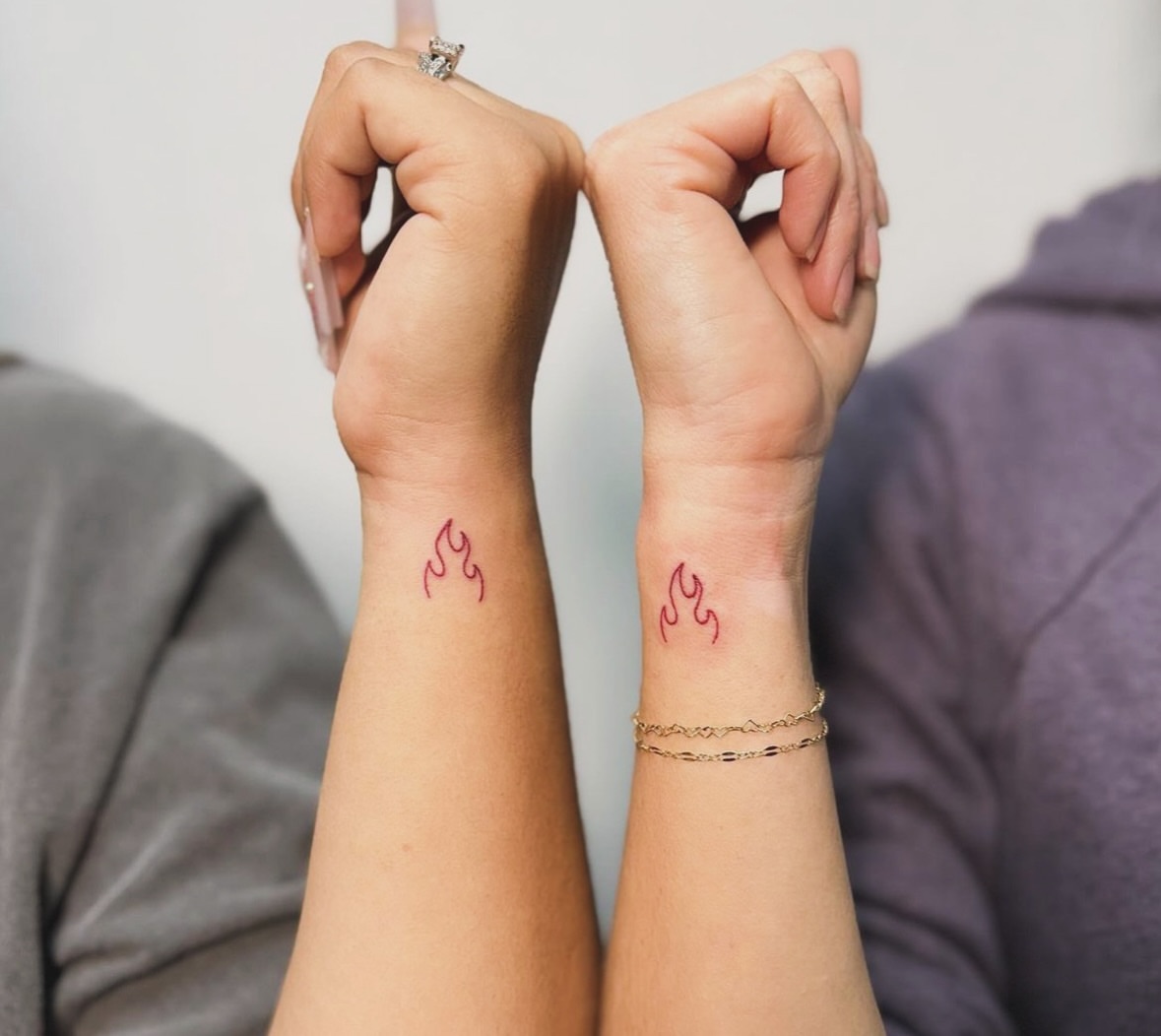Flame and symbol fine line tattoo on the forearm by JAmy Winters