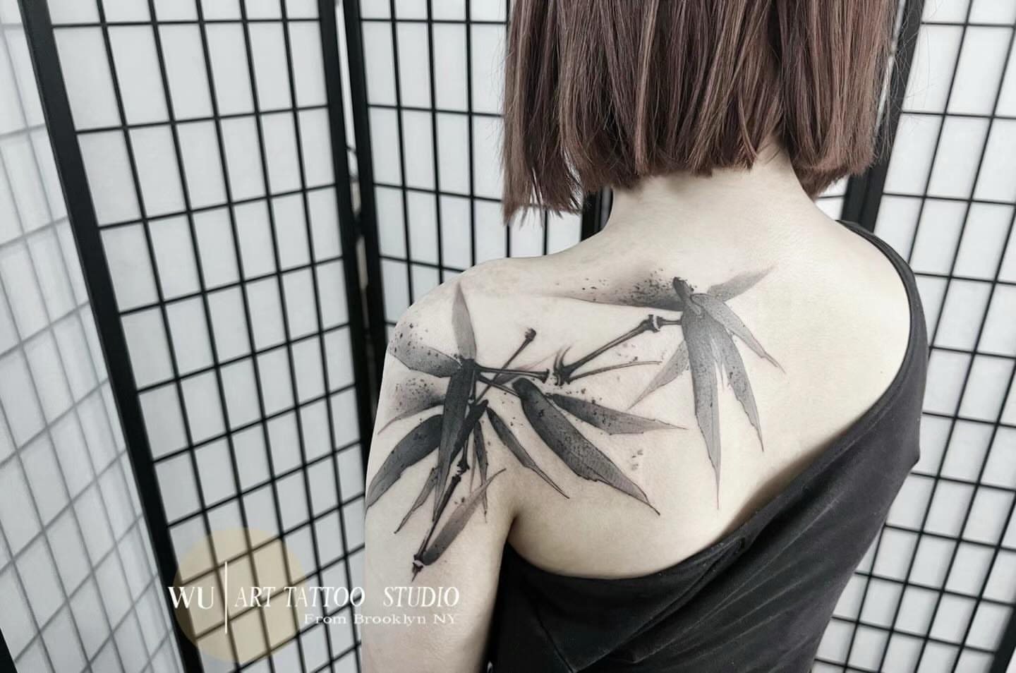 Bamboo leaves black and grey tattoo on the shoulder by Ink _daisy_