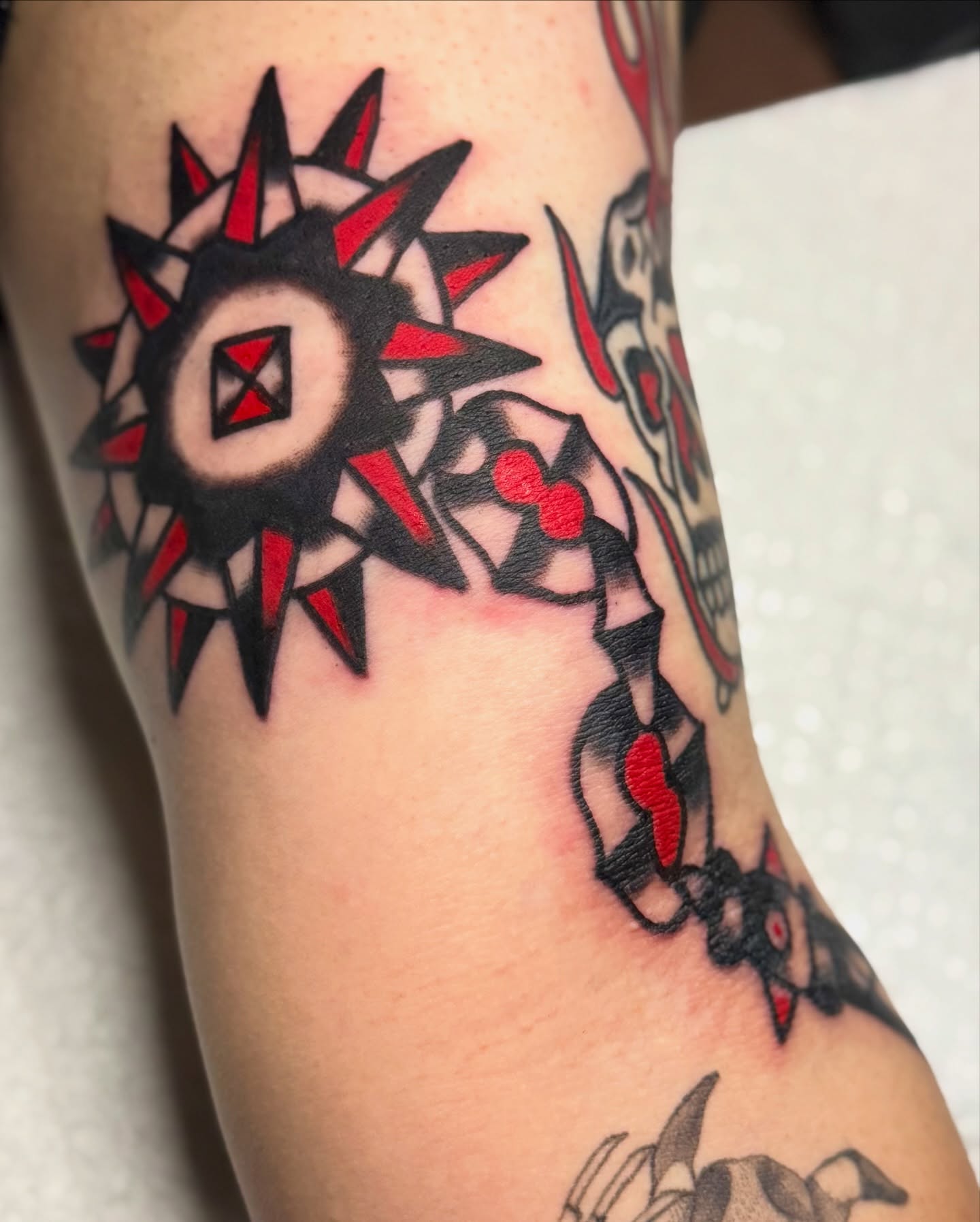 Geometric sun geometric tattoo on the forearm by Javin Klingelhoefer Mosley