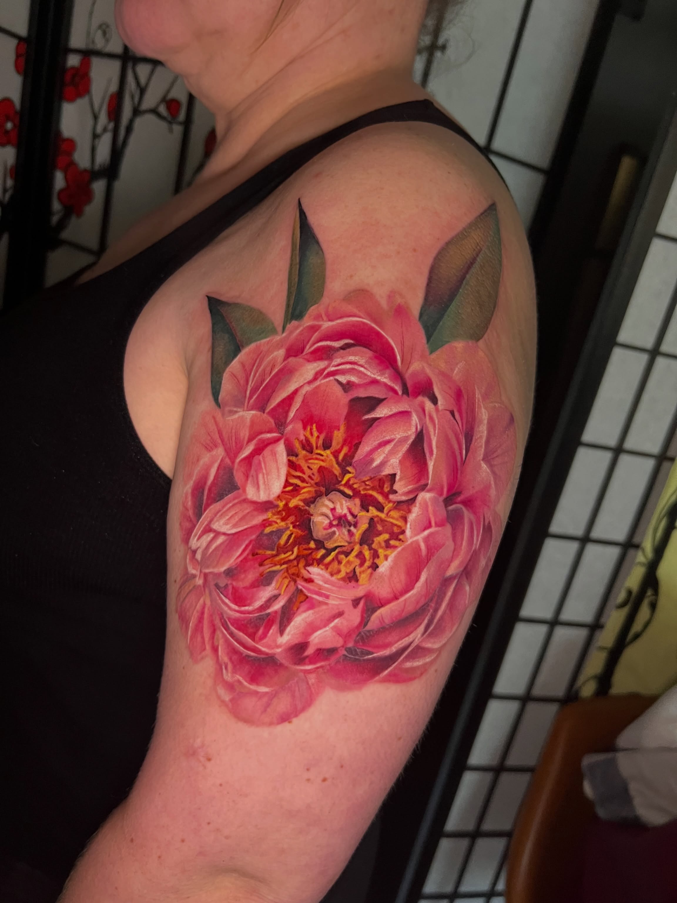 Peony realism tattoo on the shoulder by Belle Halverson