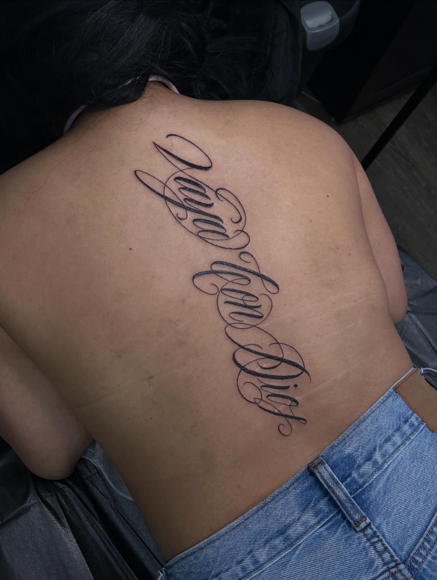 Script lettering lettering script tattoo on the back by Ximena Favela