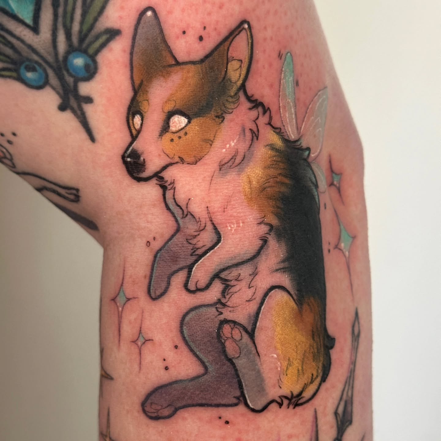 Corgi American traditional tattoo on the forearm by Sasha Wren