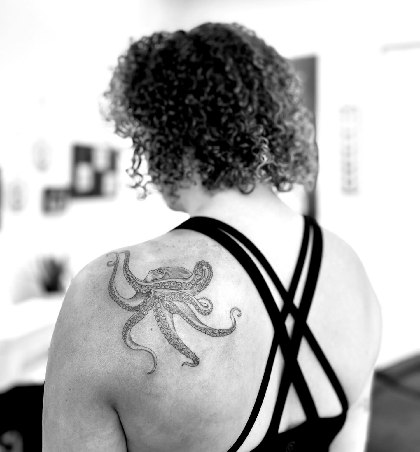 Octopus black and grey tattoo on the shoulder by L i v π Tattoo Artist. AMITY TATTOO