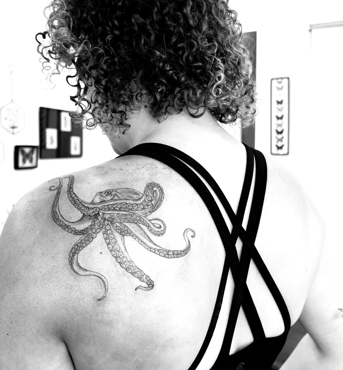 Octopus black and grey tattoo on the shoulder by L i v π Tattoo Artist. AMITY TATTOO