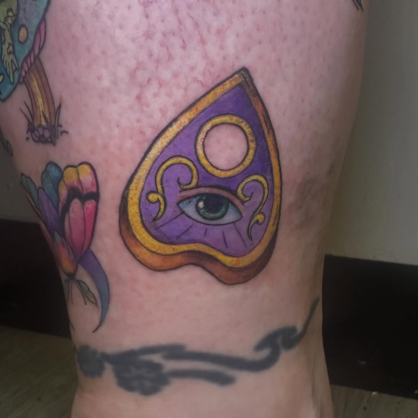 Eye and symbol new school tattoo on the thigh by Sam, Mount Laurel, New Jersey