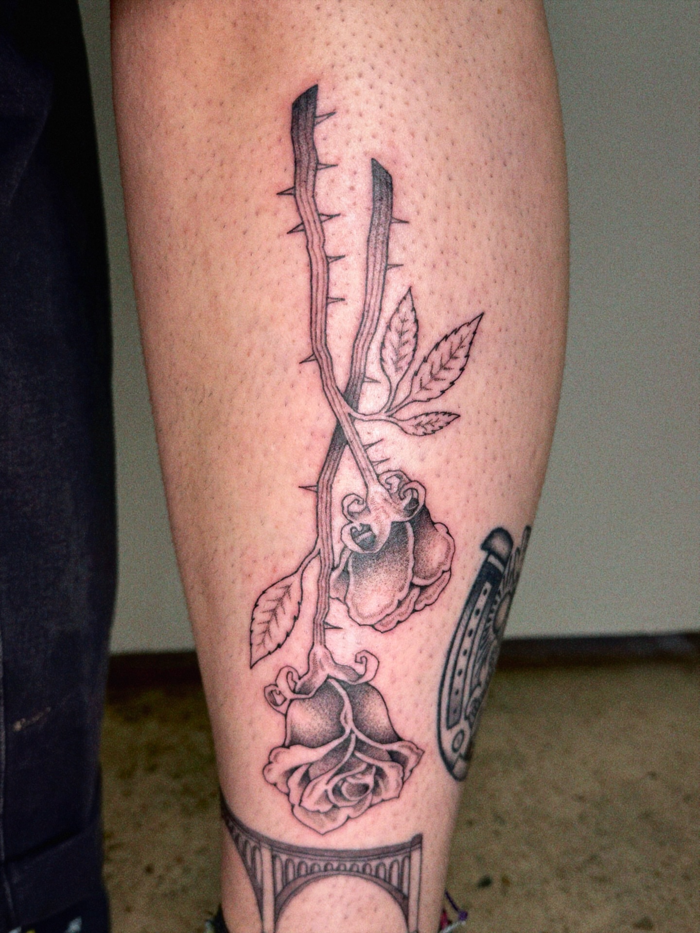 Rose and skull realism tattoo on the calf by @inkshame