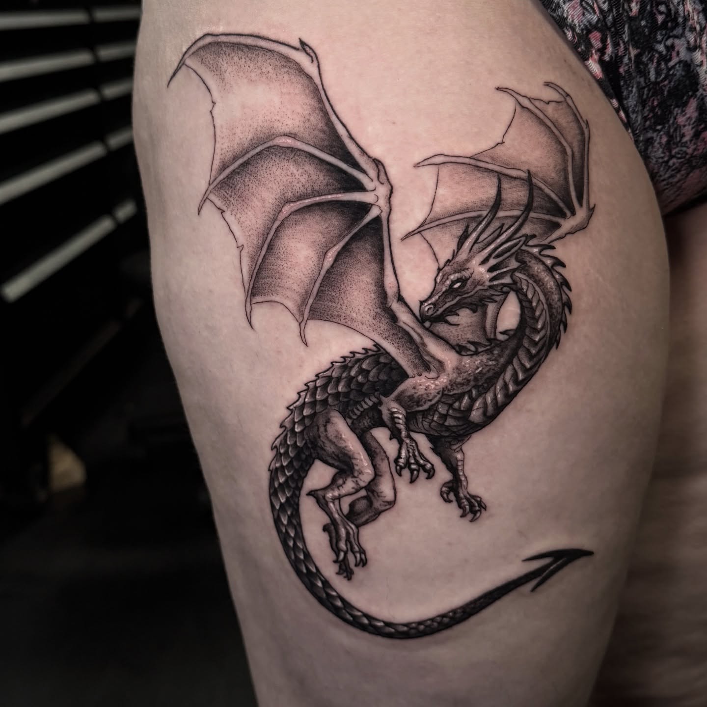 Dragon dotwork tattoo on the thigh by Madeleine Fleming