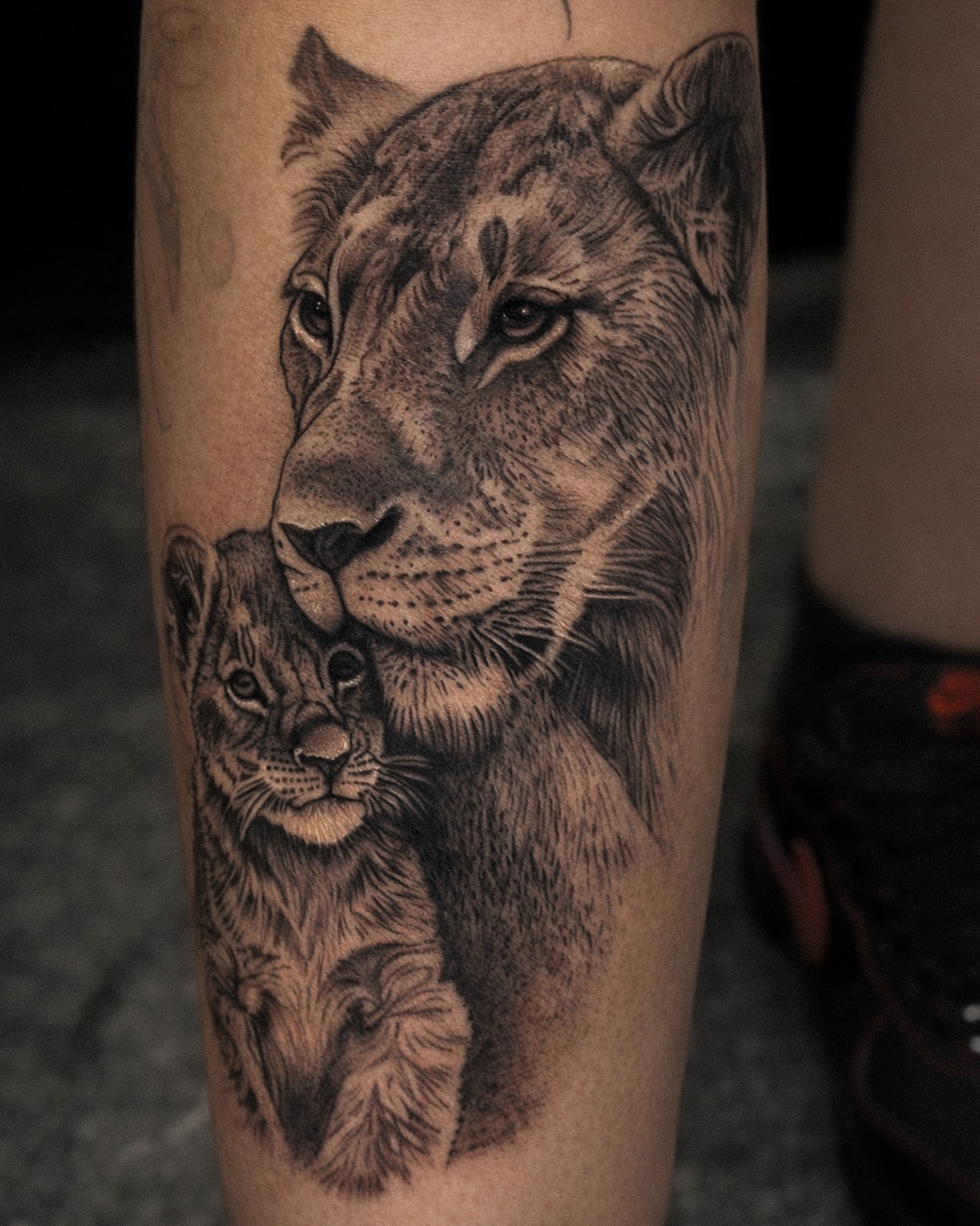 Lioness and cub realism tattoo on the forearm by Mak$ Brand