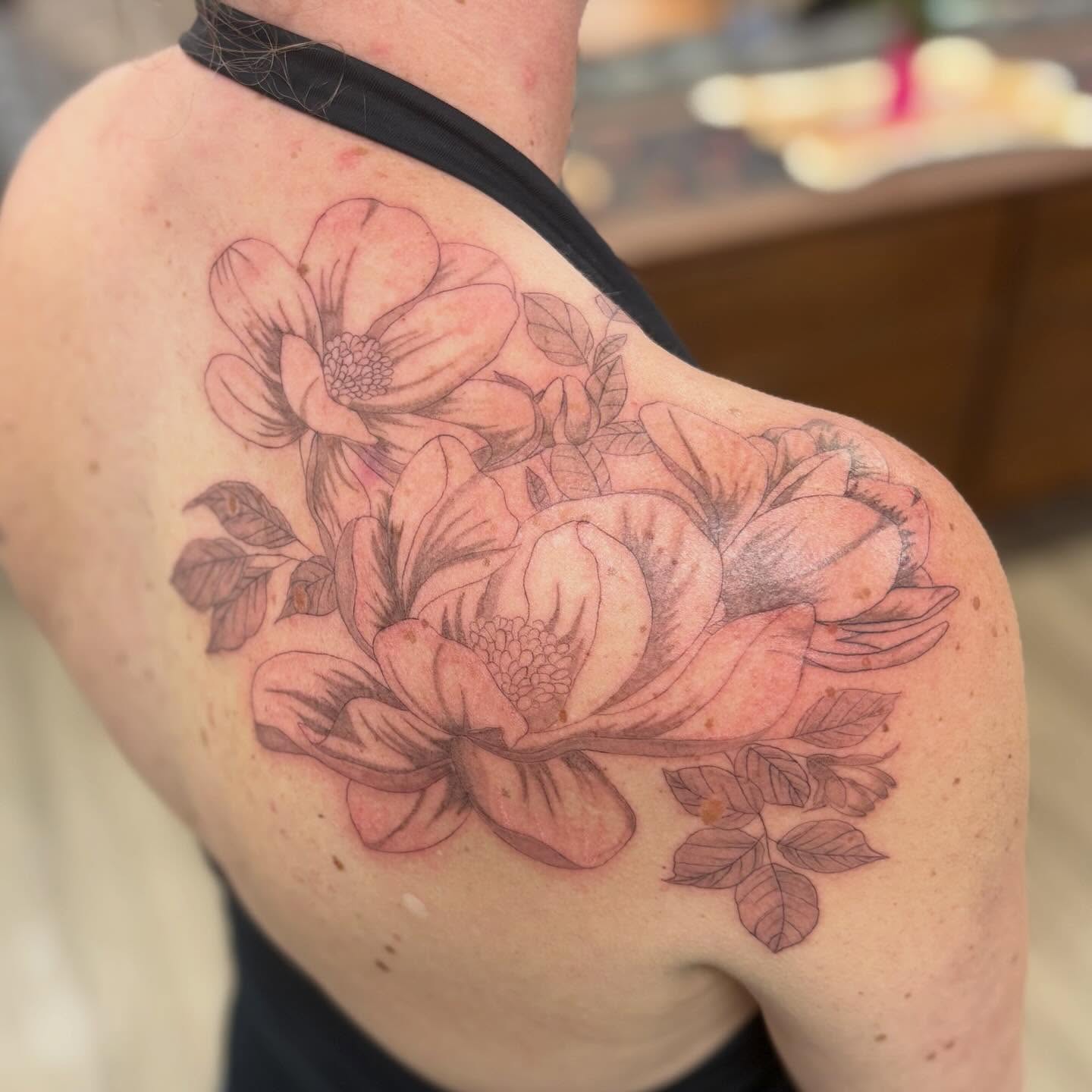 Flower bouquet black and grey tattoo on the shoulder by bradyn thornton: eco-tattoo artist