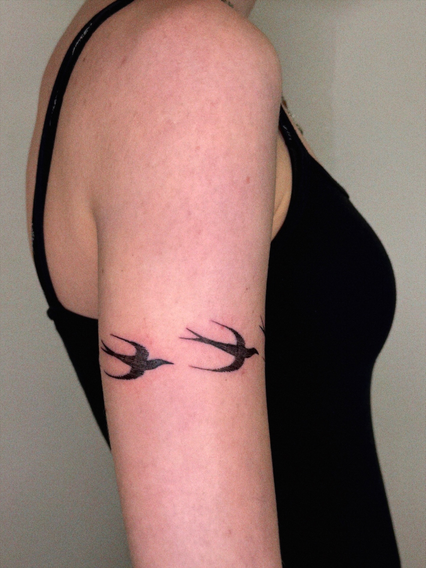 Swallows black and grey tattoo on the forearm by @inkshame