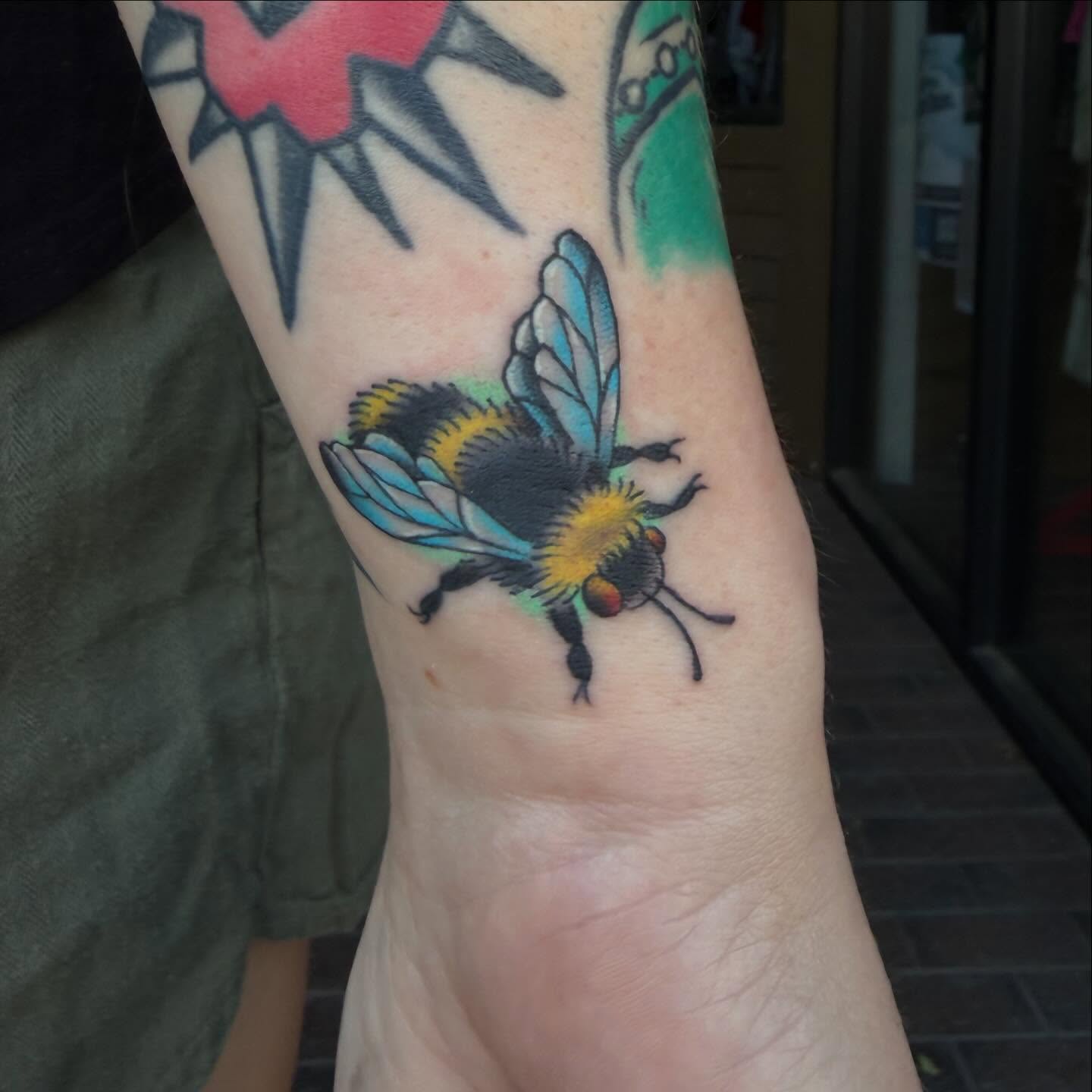 Bee realism tattoo on the forearm by Mike Lachowicz
