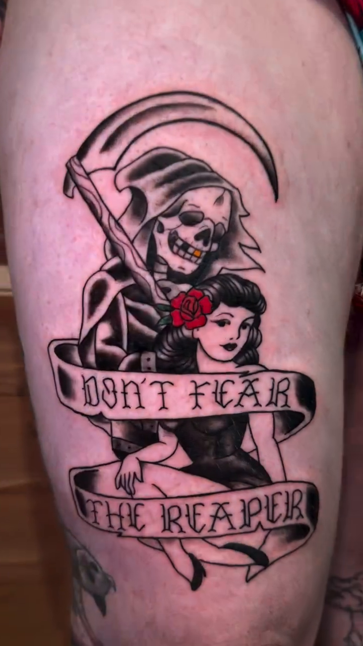 Grim reaper and pin-up girl realism tattoo on the leg by Alexander Haber