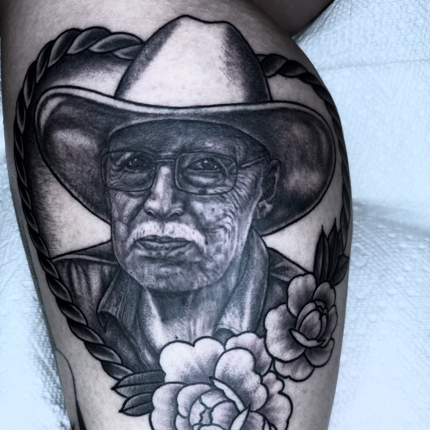 Portrait of elderly man realism tattoo on the thigh by Lisa Del Toro