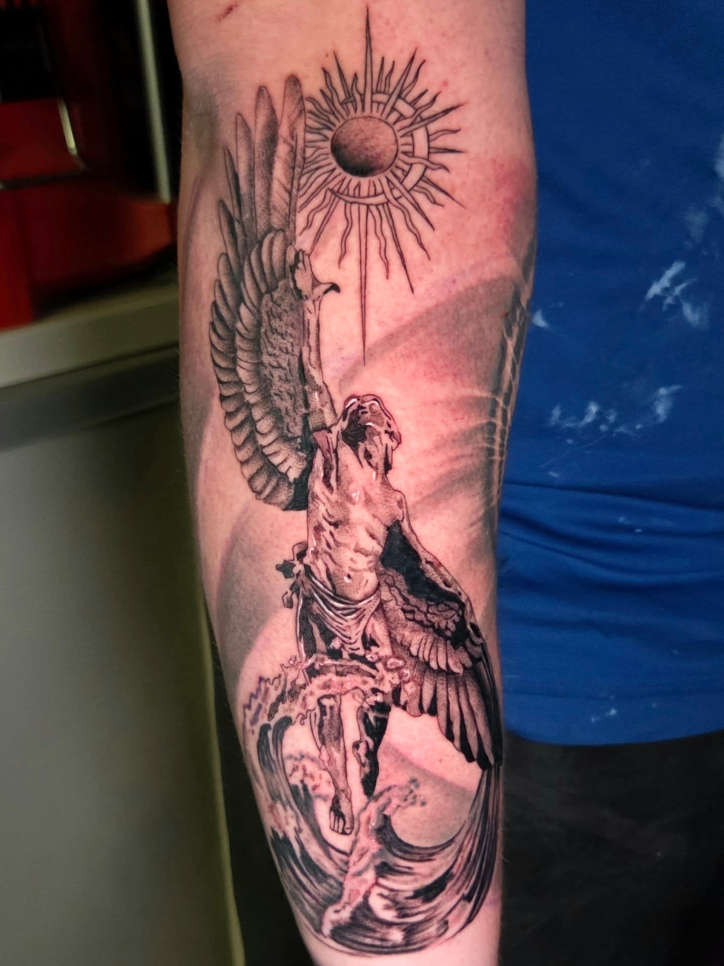 Angelic figure realism tattoo on the forearm by Maya Neideck