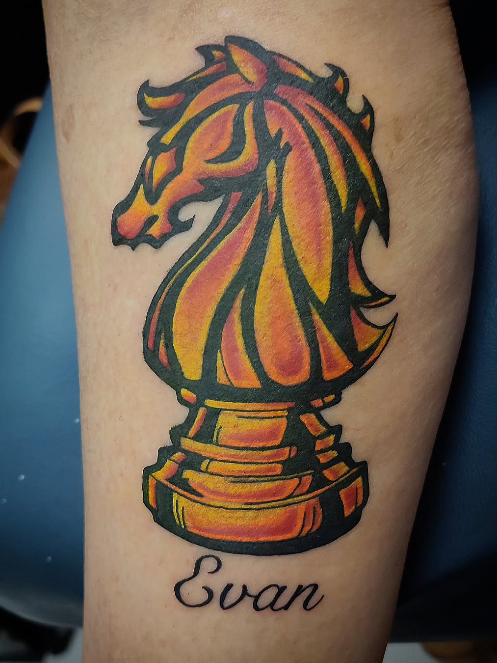 Chess knight American traditional tattoo on the forearm by Julie MacDonald