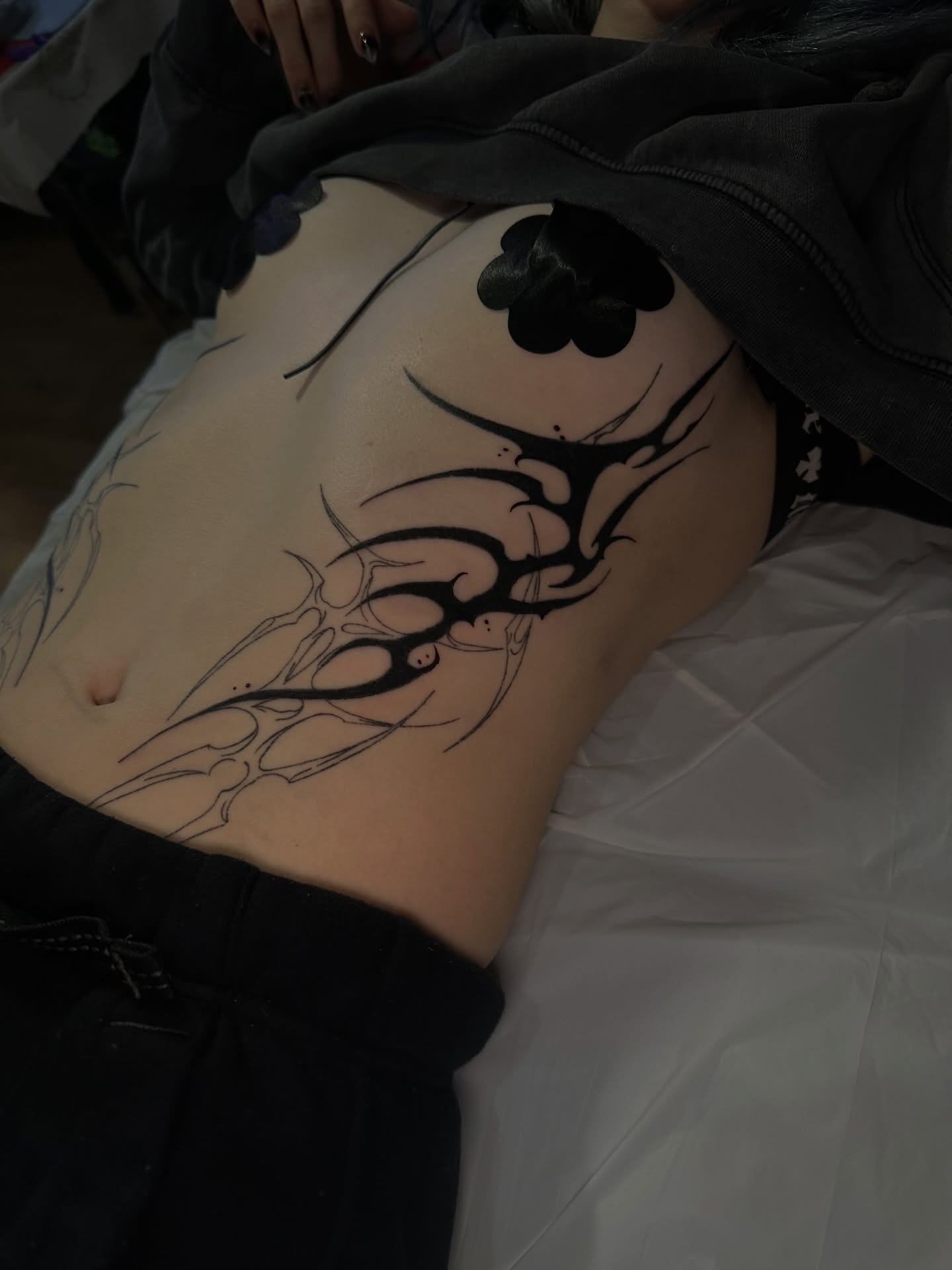 Abstract tribal design tribal tattoo on the torso by Yassin alsaje