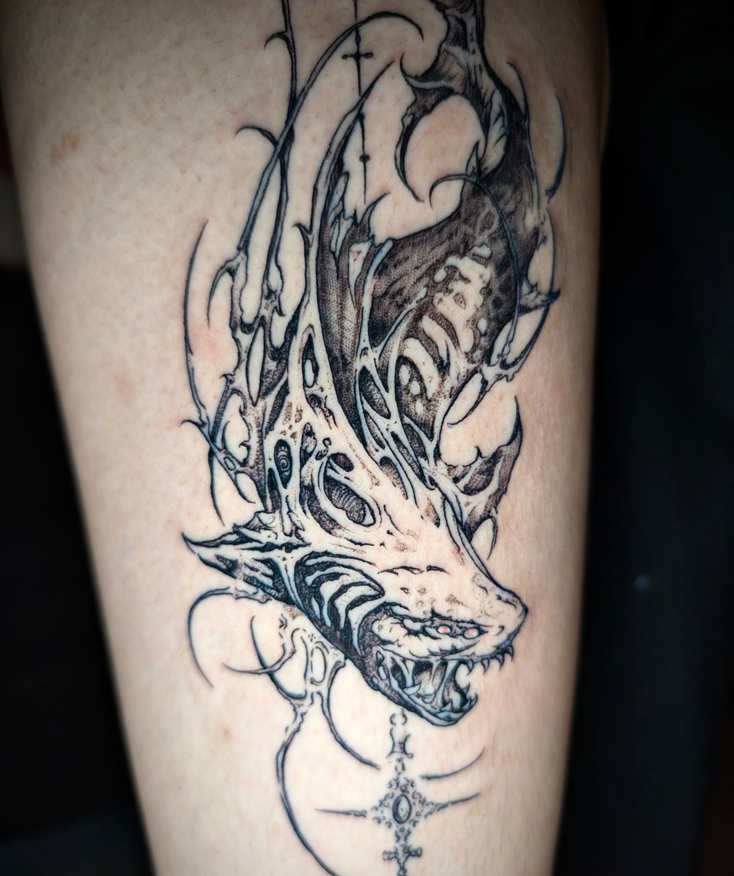 Dragon dark realism tattoo on the forearm by Quin Walker