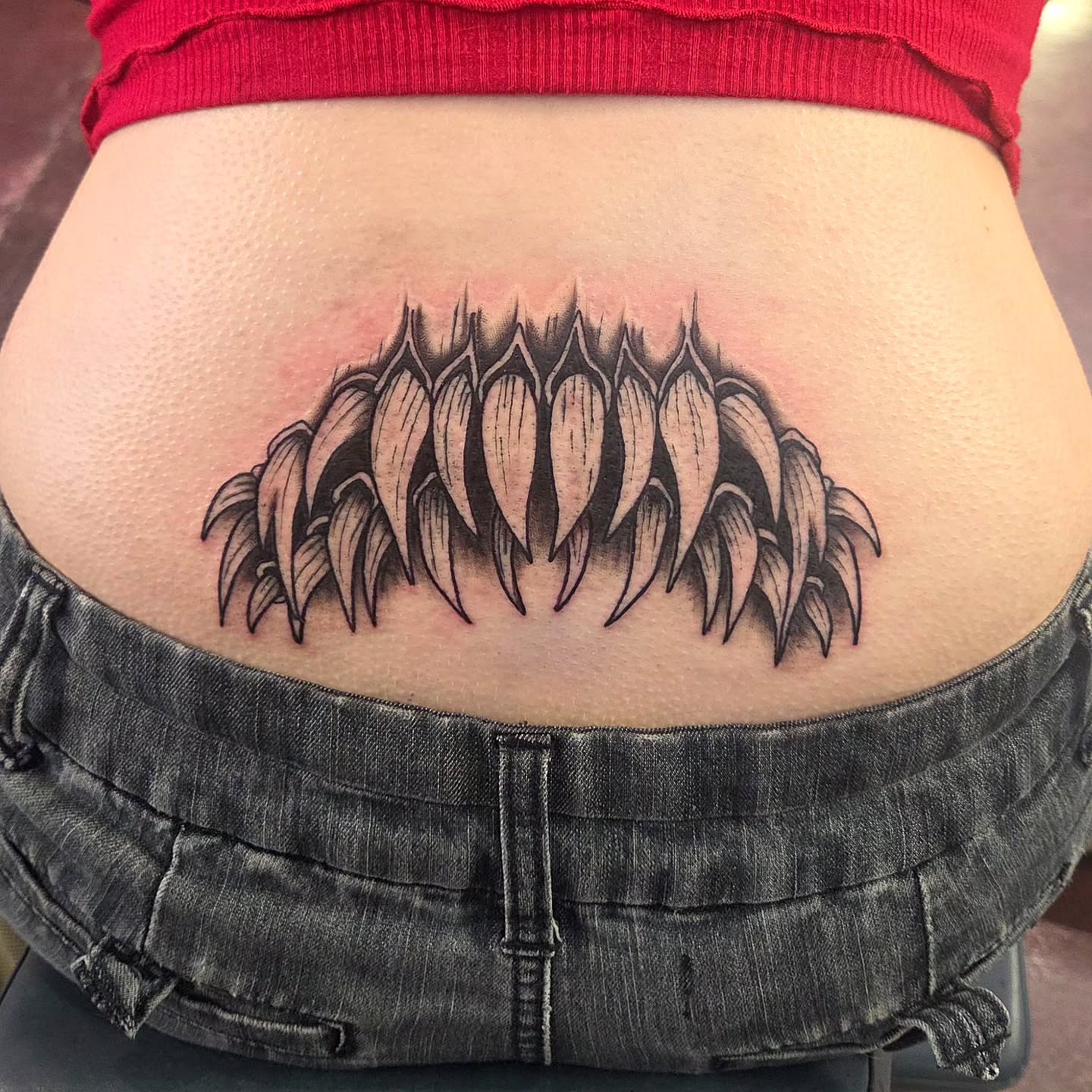 Sunflower black and grey tattoo on the torso by Kat Coniglio Art