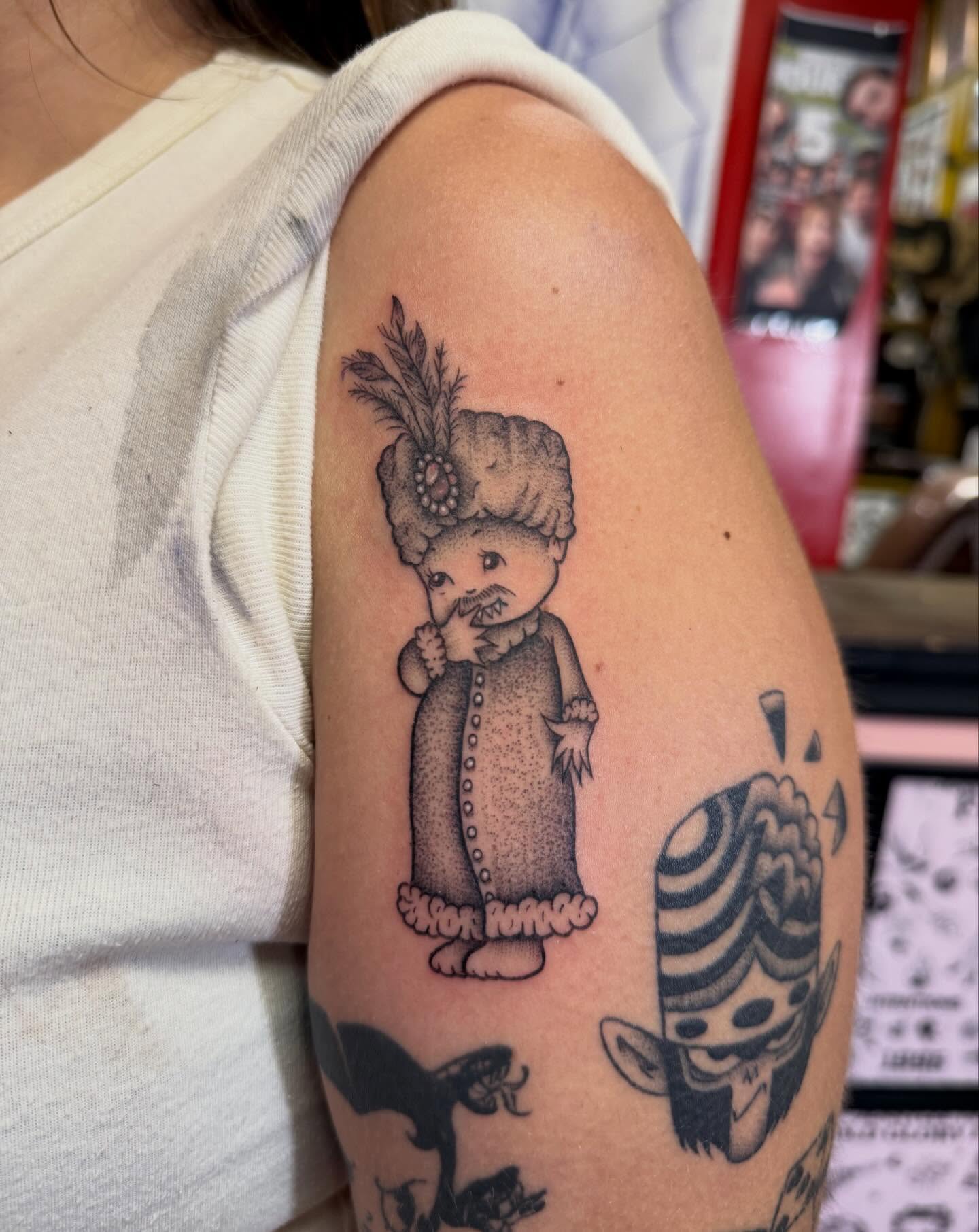 Old-fashioned doll black and grey tattoo on the shoulder by Jennylee Aerts, Asbury Park, New Jersey