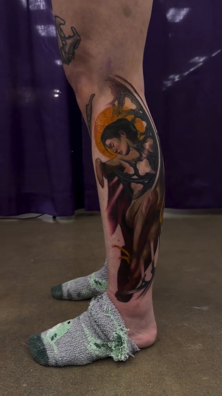 Woman with flowing hair and flames realism tattoo by Austin Jones