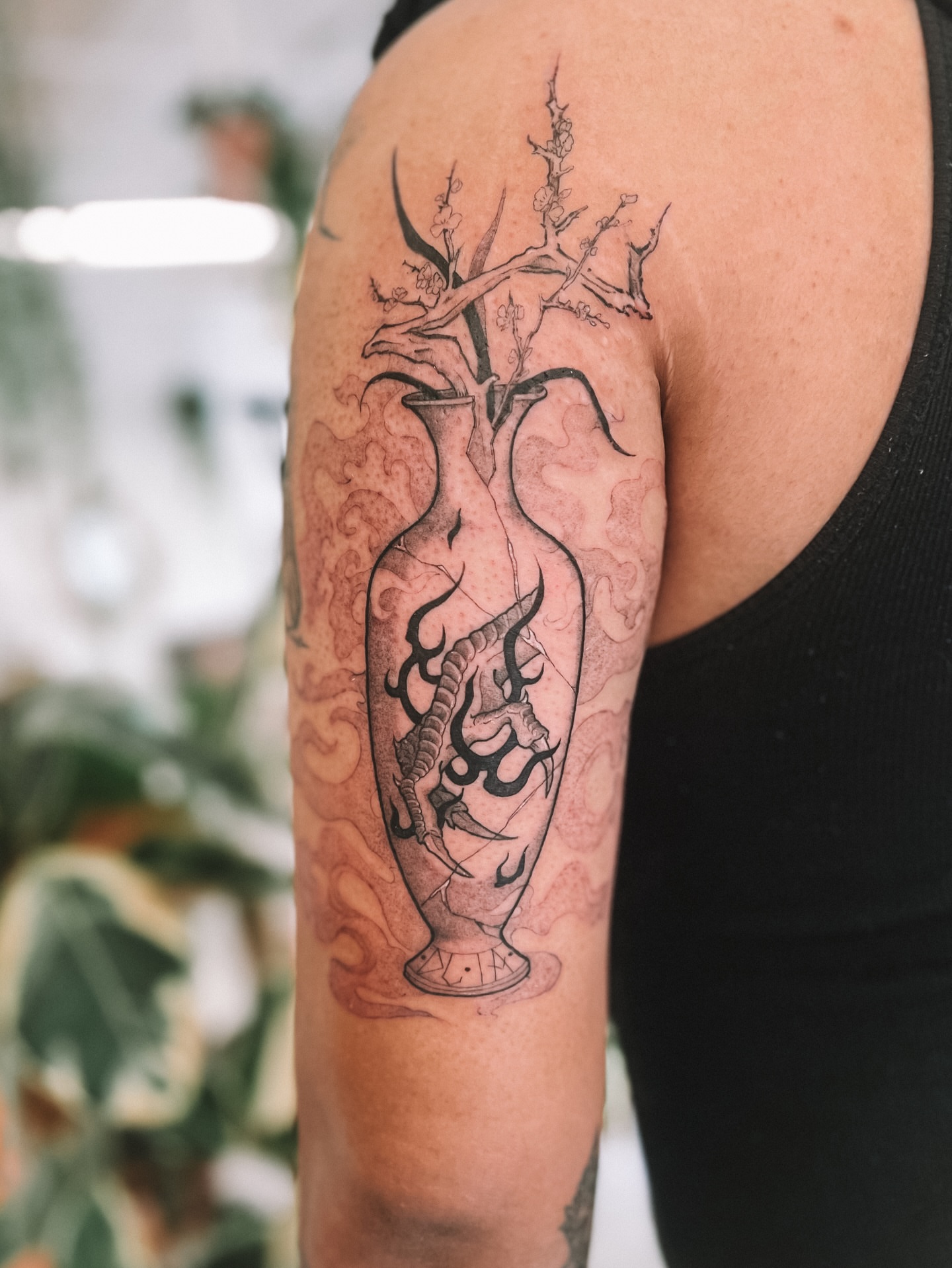 Vase with dragon realism tattoo on the upper arm by sebs phạm, Los Angeles, California