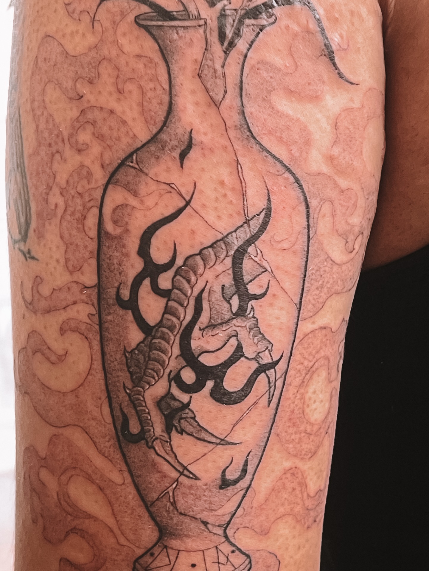 Serpent in vase black and grey tattoo on the forearm by sebs phạm, Los Angeles, California
