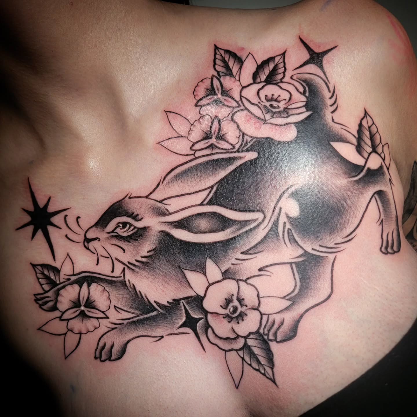 Rabbit and flowers American traditional tattoo on the shoulder by Randyz Tattyz