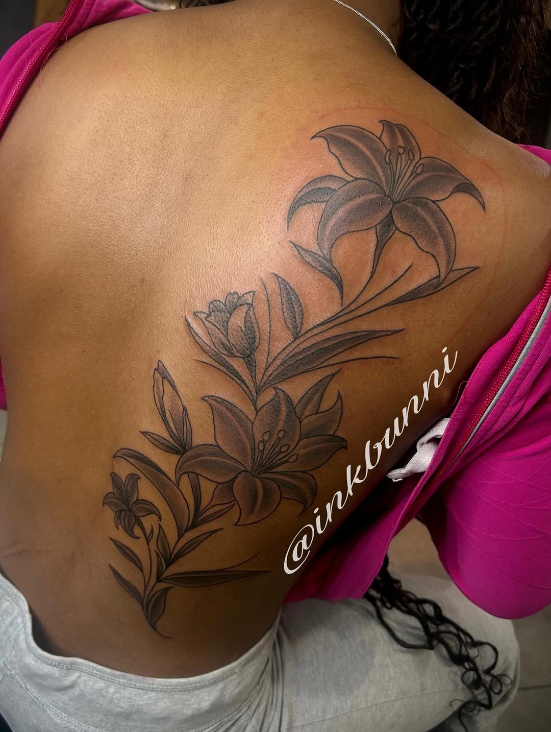 Lily flowers fine line tattoo on the back by Hailey Aka inkbunni, Detroit, Michigan